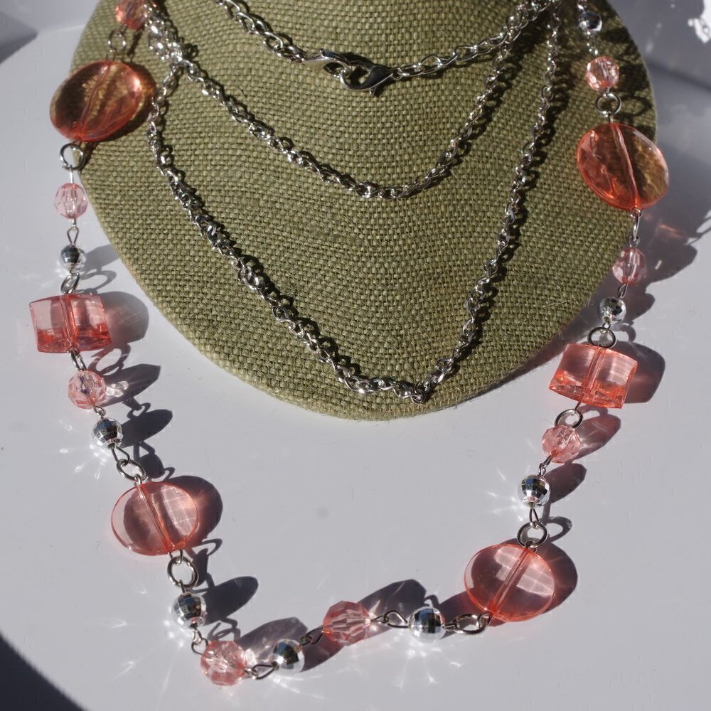 Women`s silver tone pink beaded chain necklace.
